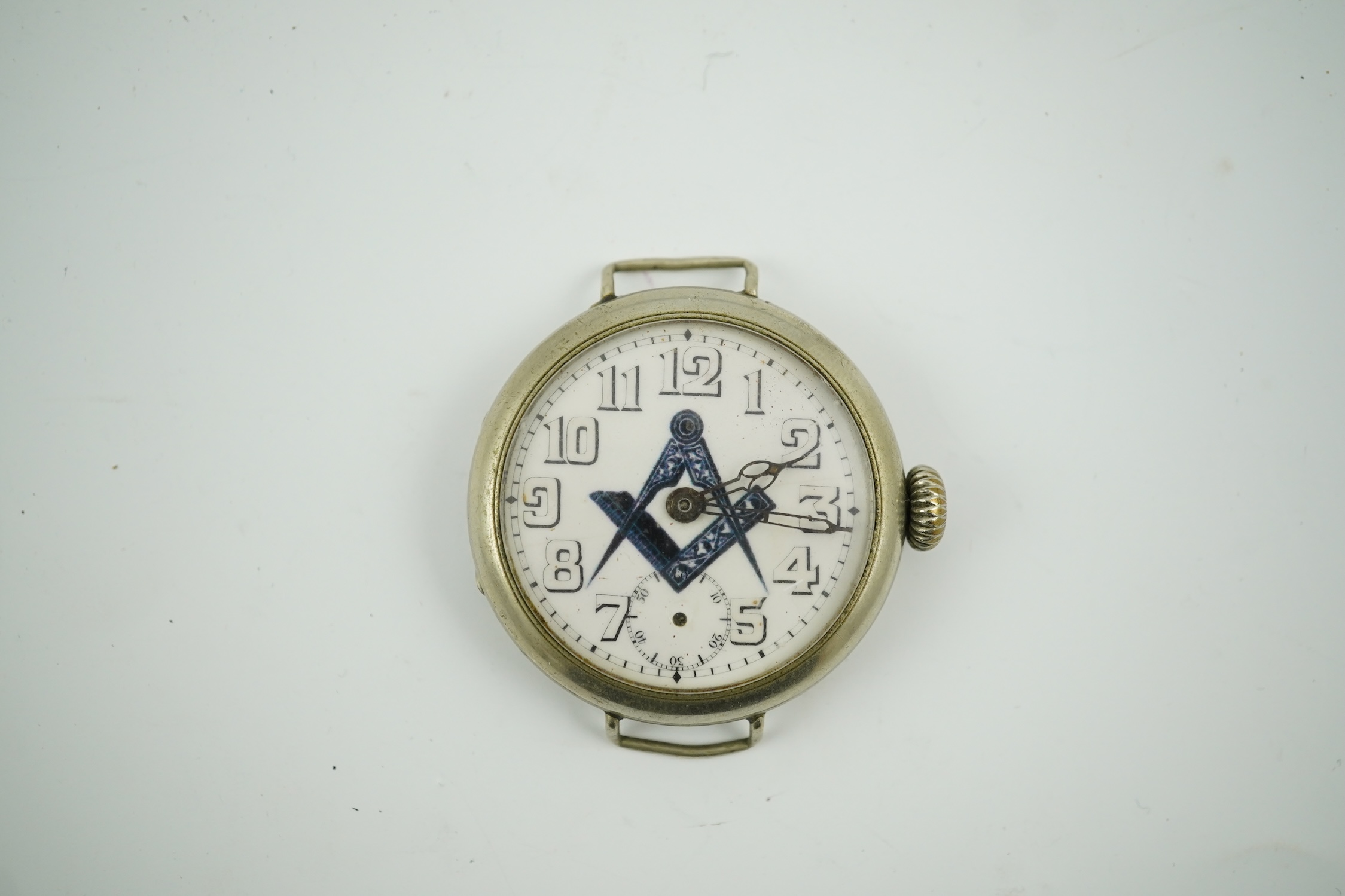 A nickel cased masonic manual wind wrist watch, with subsidiary seconds(no hand), case diameter 37mm. No strap. Condition - poor